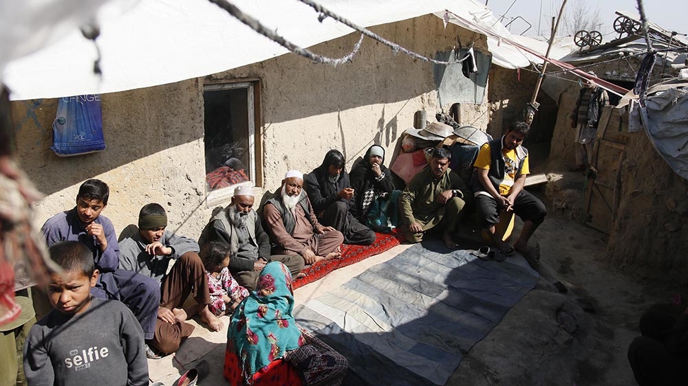 Residents gather at a camp for internally displaced people outside Kabul, where roughly half of the families are from Kunduz [Jawad Jalali/Al Jazeera]