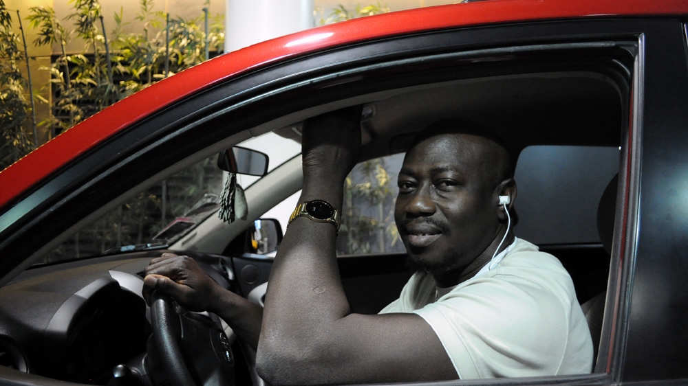 Ibrahima Conde, 40, who relocated to Las Vegas in 2012 and first worked in casino-hotels before becoming a driver for hire through e-hailing service, Lyft [Joe Jackson/Al Jazeera]