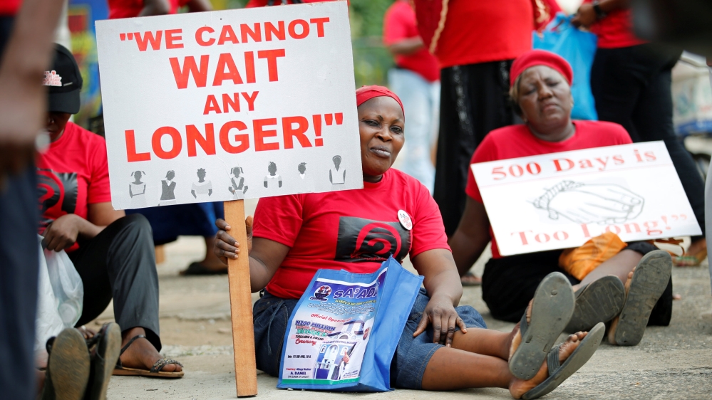 Women carrying placards attend a street protest campaigning for the rescue of abducted Chibok girls, in the Ikeja district of Lagos