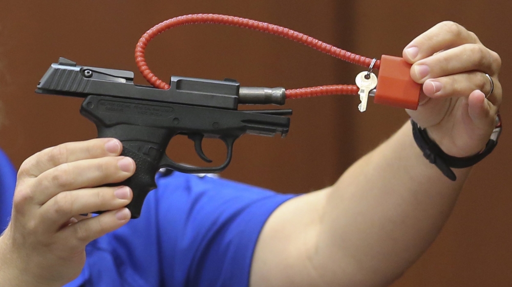  The bidding for the gun began at $5,000, before it was removed from the site [Gary W Green/EPA] The bidding for the gun began at $5,000, before it was removed from the site [Gary W Green/EPA]