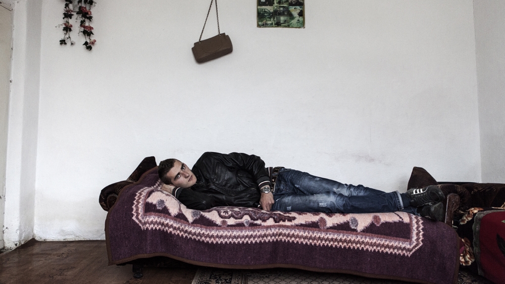 Basmir Gjeloshaj lost his father and two uncles to a blood feud. Apart from a year or so when he was living in Sweden, he has been confined to his home since he was six years old [Carlo Gianferro/Al Jazeera] 