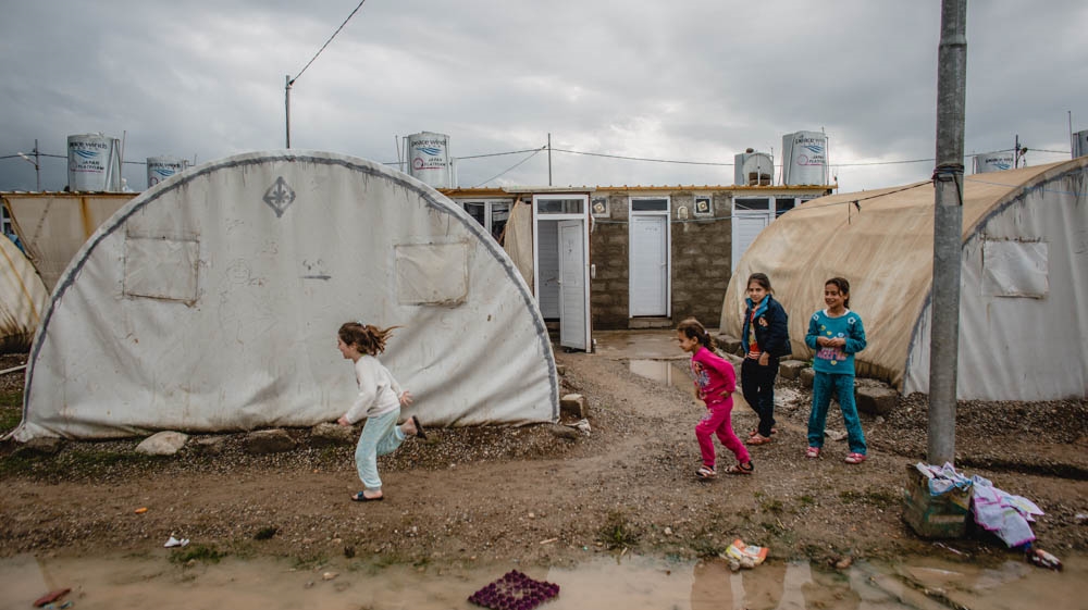 Poor road infrastructure, electricity shortages and few employment opportunities plague Iraq's Chamisku refugee camp [Andrea DiCenzo/Al Jazeera]