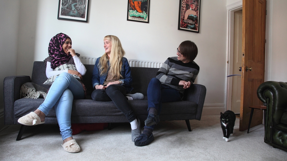 Stephanie Allen and Jeremy Dunham say that Hajer A'Sharafeh has become 'a part of their family' [Rich Wiles/ Al Jazeera]