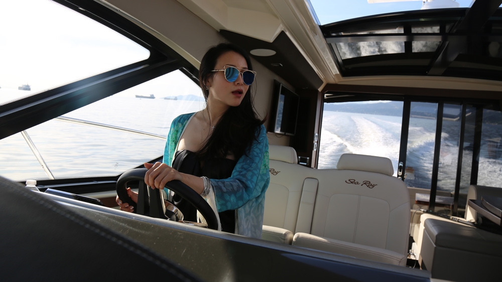 'People hungered to know more about who was buying the exotic supercars, exclusive handbags and multimillion-dollar properties,' says Li [Steve Chao/Al Jazeera]