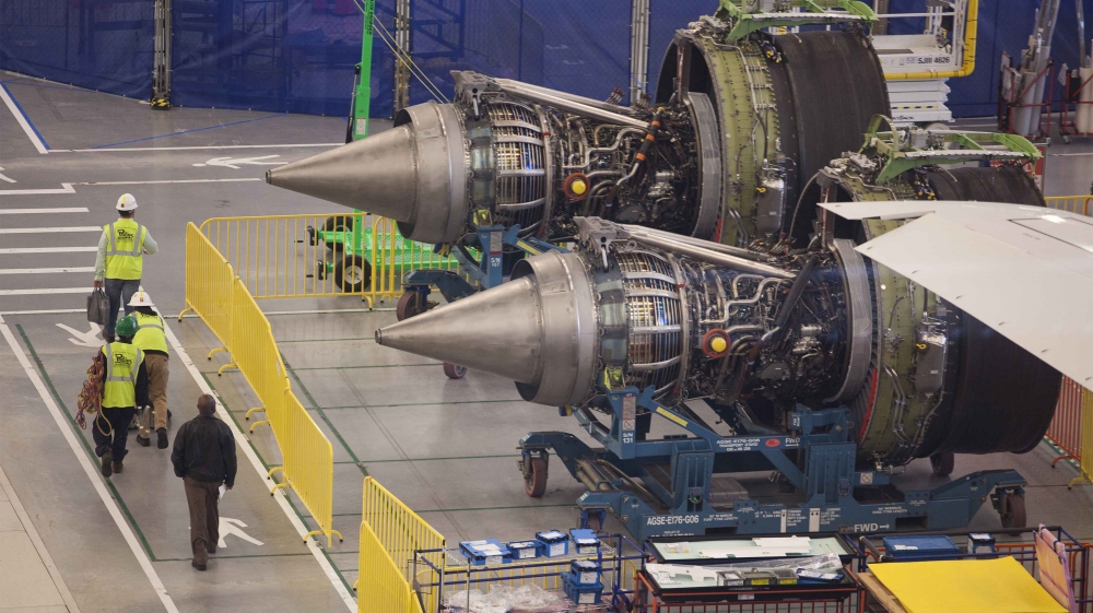 Workers at South Carolina Boeing walk past the engines of a 787 Dreamliner being made for Air India at the plant''s final assembly building in North Charleston