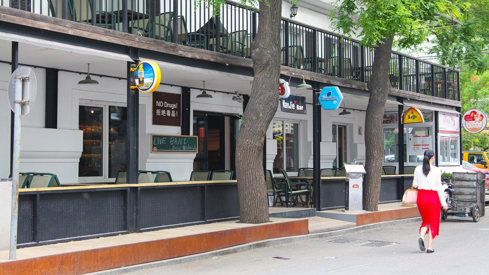 A bar in Beijing's fashionable Sanlitun district displays a sign saying 'No Drugs!' [Allison Griner/Al Jazeera]