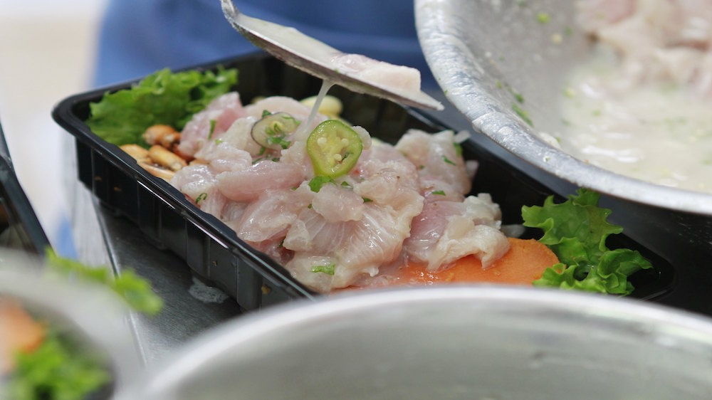 A cook prepares a traditional dish known as Ceviche during the Mistura gastronomic fair in Lima [Enrique Castro-Mendivi/REUTERS] 