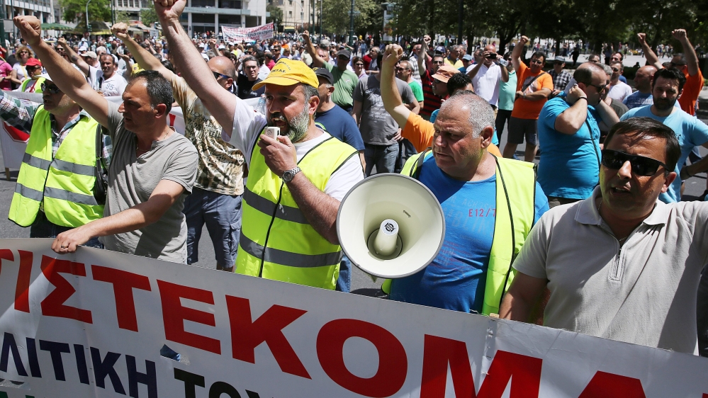 Port workers shout slogans during a demonstration against the privatisation of the ports of Piraeus and Thessaloniki, in Athens, Greece [EPA]