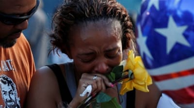 Victor Taylor supports Keaka Wallace who says she was a patrol partner of the Dallas Area Rapid Transit police officer Brent Thompson who was shot dead [REUTERS]