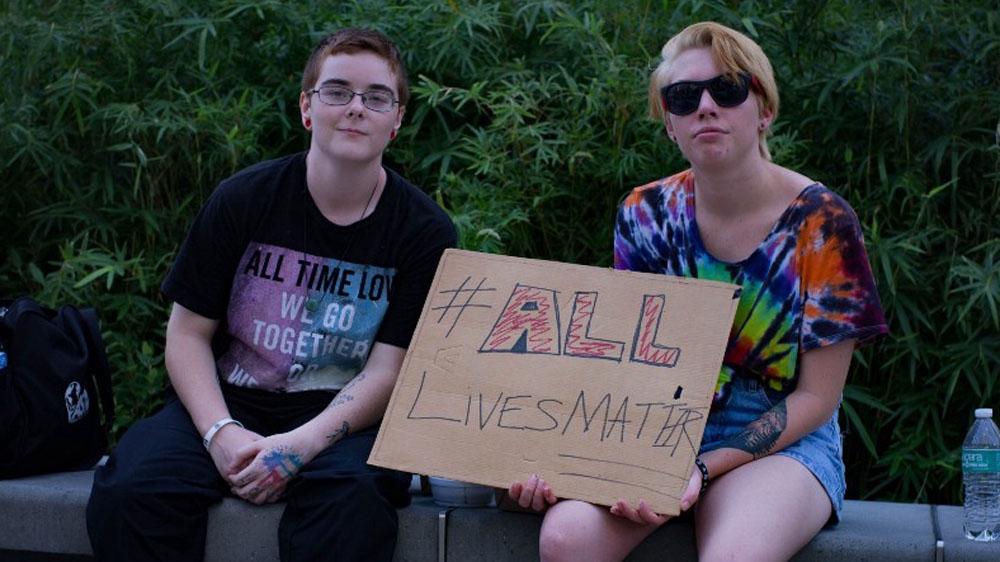 Saven, left, and Paxton, right, are both local college students who declined to provide their last names [Randy R Potts/Al Jazeera]