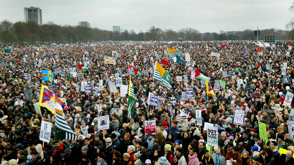 Anti-war protesters mass in Hyde Park during the demonstration against the Iraq invasion on February 15, 2003 [Toby Melville/Reuters]