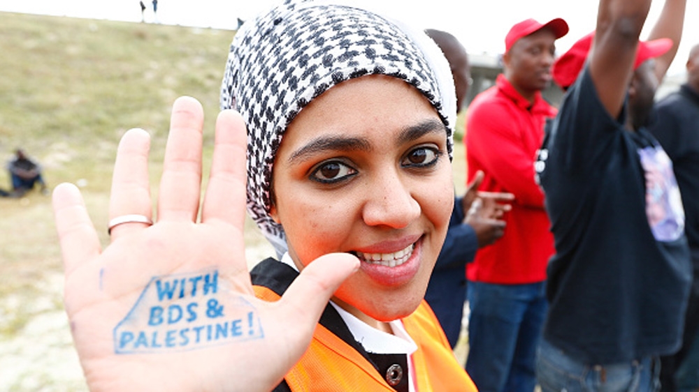 Pro-Palestinian protestor supporting the BDS campaign against Israel demonstrates in Cape Town, South Africa [Getty]