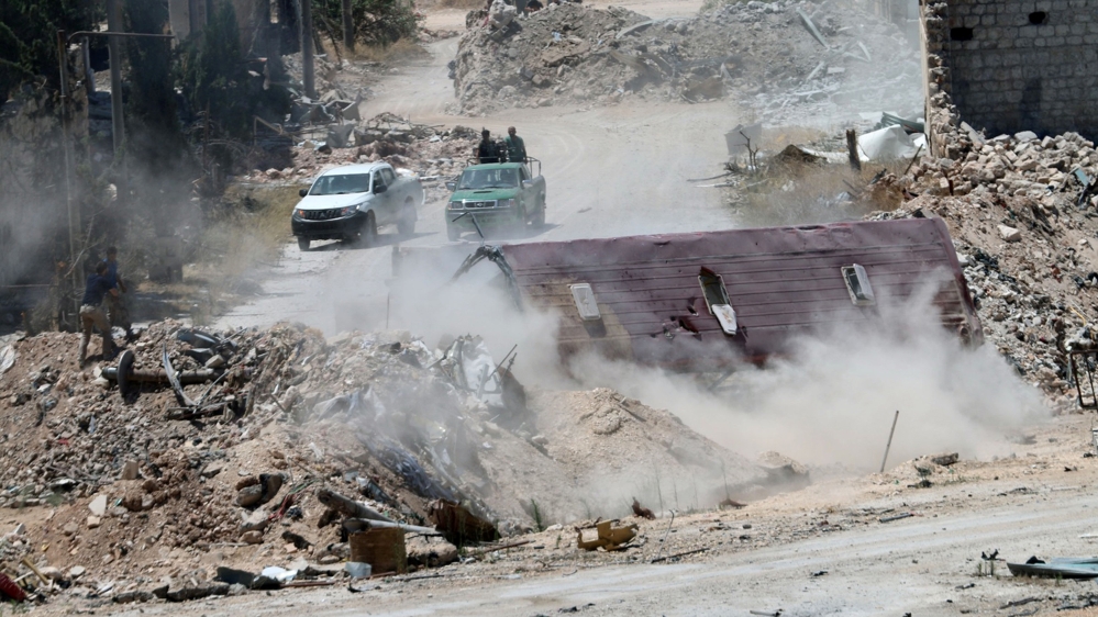 Forces loyal to Syria''s President Bashar al-Assad are seen near barricades after they advanced on the southern side of the Castello road in Aleppo