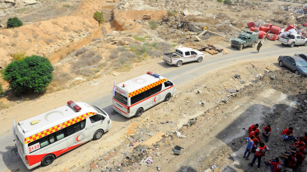 A Syrian Arab Red Crescent convoy reaches the Damascus suburb of Daraya