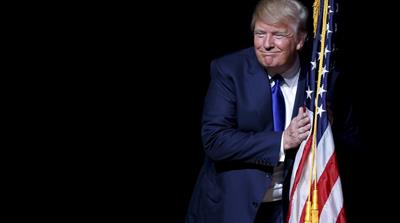 Trump campaigning under the slogan, 