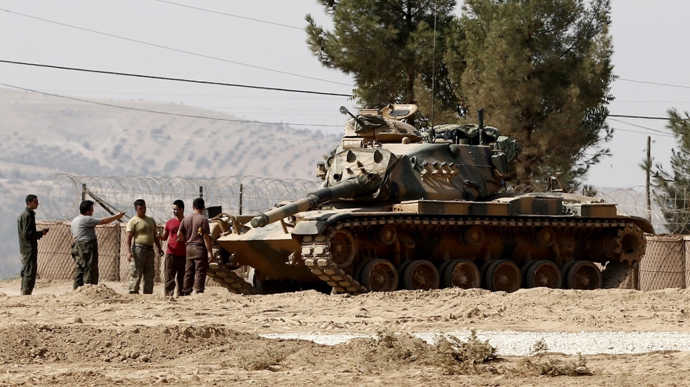 Turkey views the YPG as a threat because of its close links to the PKK [Sedat Suna/EPA]