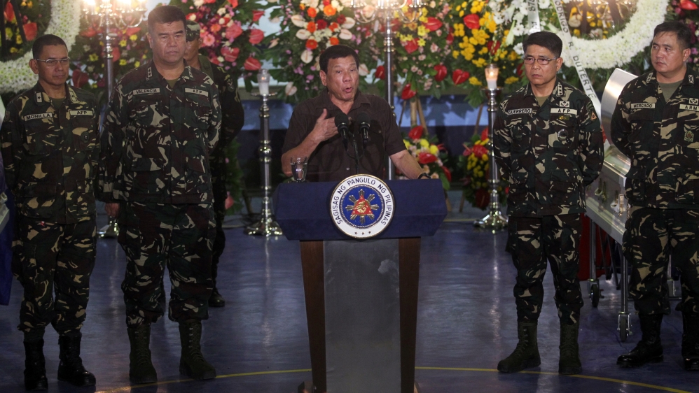 Philippine President Rodrigo Duterte recently spoke at the wake of a soldier killed in an encounter with communist rebels [Lean Daval Jr/Reuters]