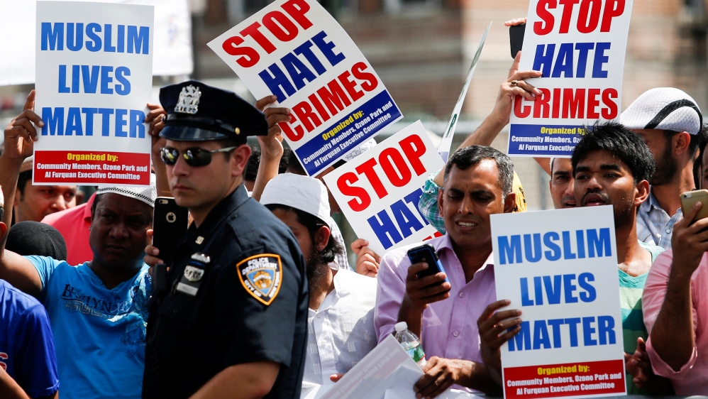 Community members take part in a protest to demand stop hate crime during the funeral service of Maulama Akonjee, and Uddin in the Queens borough of New York City