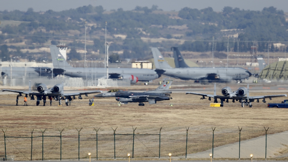 A Turkish Air Force F-16 fighter jet is seen between U.S. Air Force A-10 Thunderbolt II fighter jets at Incirlik airbase in Adana, Turkey