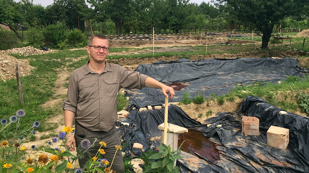 Professor Norbert Pap at Turbek Hill, where he thinks his team has found the remains of the tomb of Suleiman the Magnificent, who died in the area 450 years ago [Dan McLaughlin/Al Jazeera]