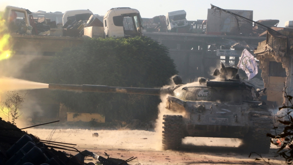 A Free Syrian Army tank fires in Ramousah area southwest of Aleppo