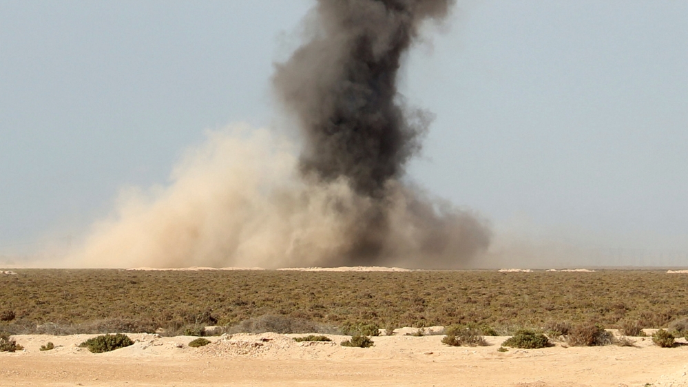 Smoke rises as Libyan forces dispose of explosives left behind by Islamic State militants following a battle in Sirte, at Misrata, Libya [Reuters]