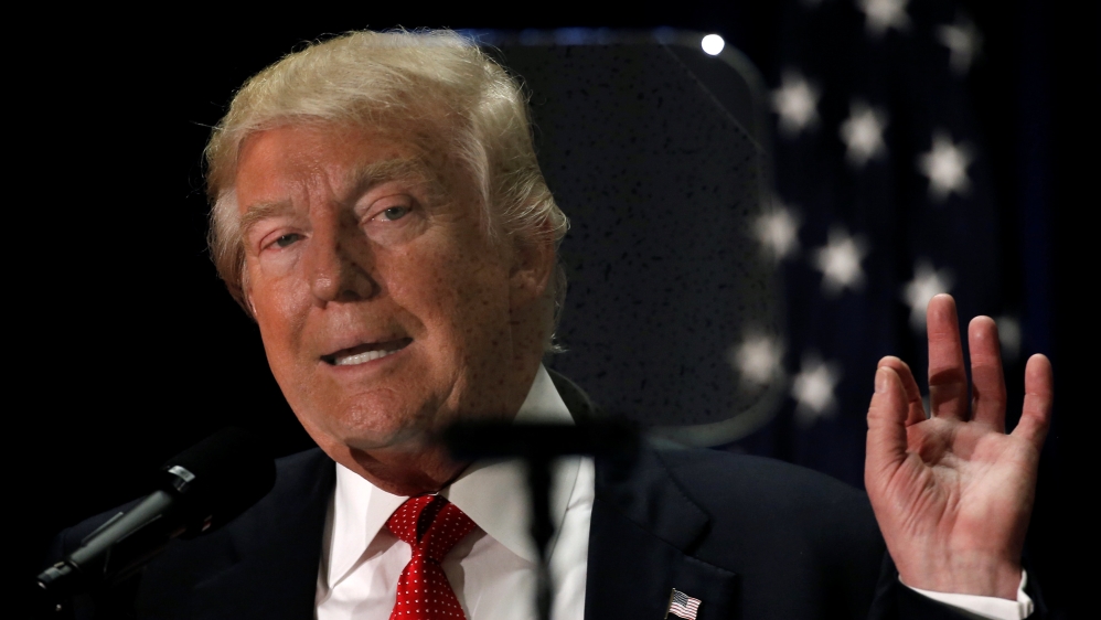 Republican presidential nominee Donald Trump reads off a teleprompter as he speaks at the Cleveland Arts and Social Sciences Academy in Cleveland