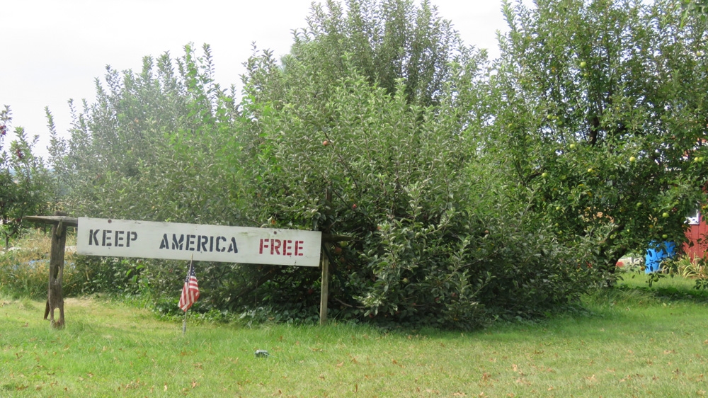 
Outside of an Amish home in Lancaster County, a sign reads: 'Keep America Free' [Jessica Sarhan/Al Jazeera]
