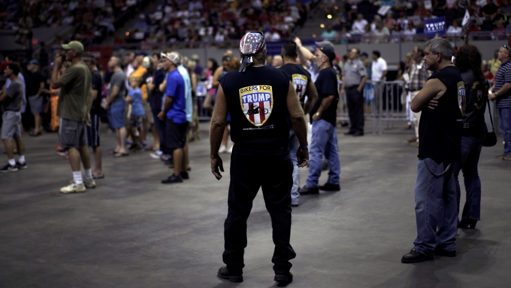 Supporters of Republican presidential nominee Donald Trump listen as he speaks at a campaign rally in Pensacola