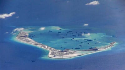 Chinese dredging vessels are purportedly seen in the waters around Mischief Reef in the disputed Spratly Islands in the South China Sea viewed in May 2015 [Reuters]