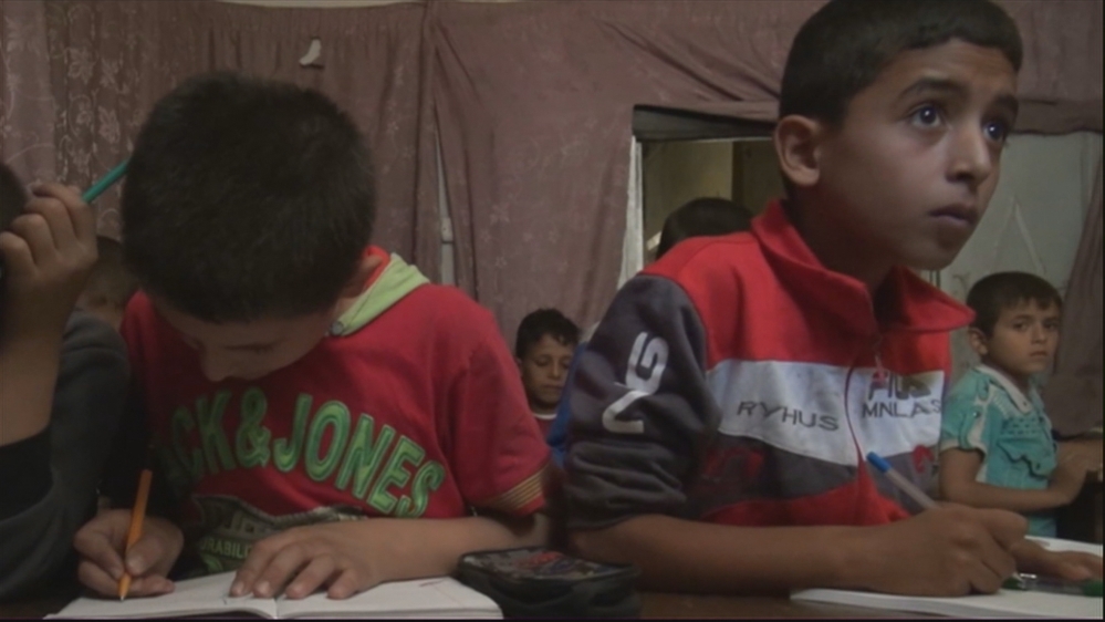 Children attend underground school in Syria''s Aleppo