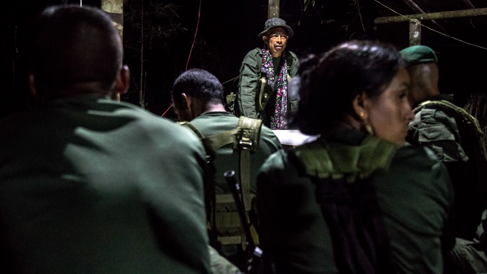 Commander Raul answers questions from his fighters [Tomas Ayuso/Al Jazeera] 