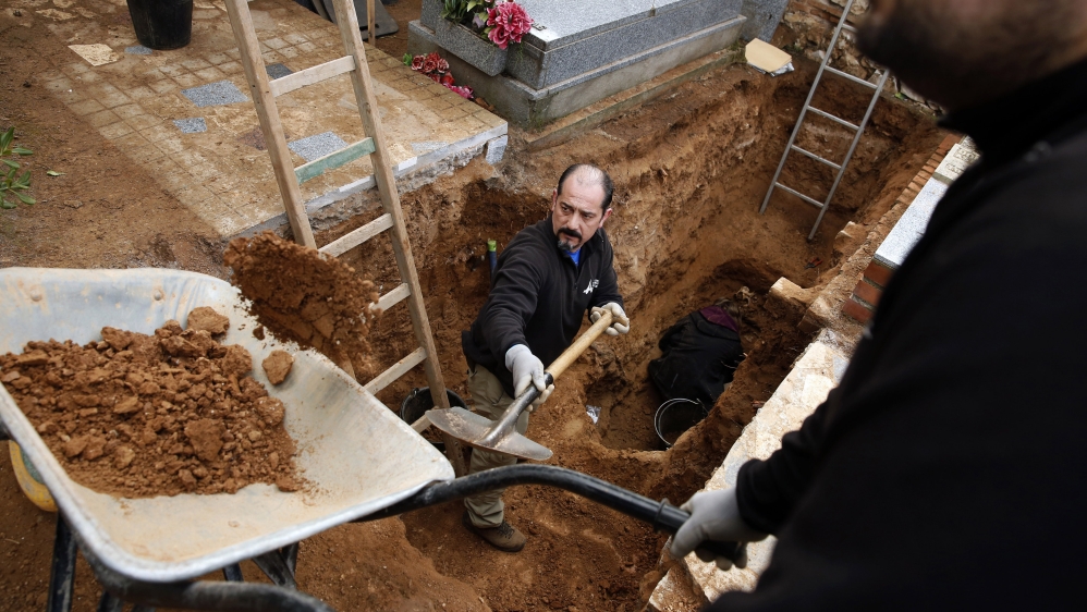 Members of the Association for the Recovery of Historical Memory take part in a grave exhumation in Guadalajara's cemetery in January [Juan Medina/Reuters]