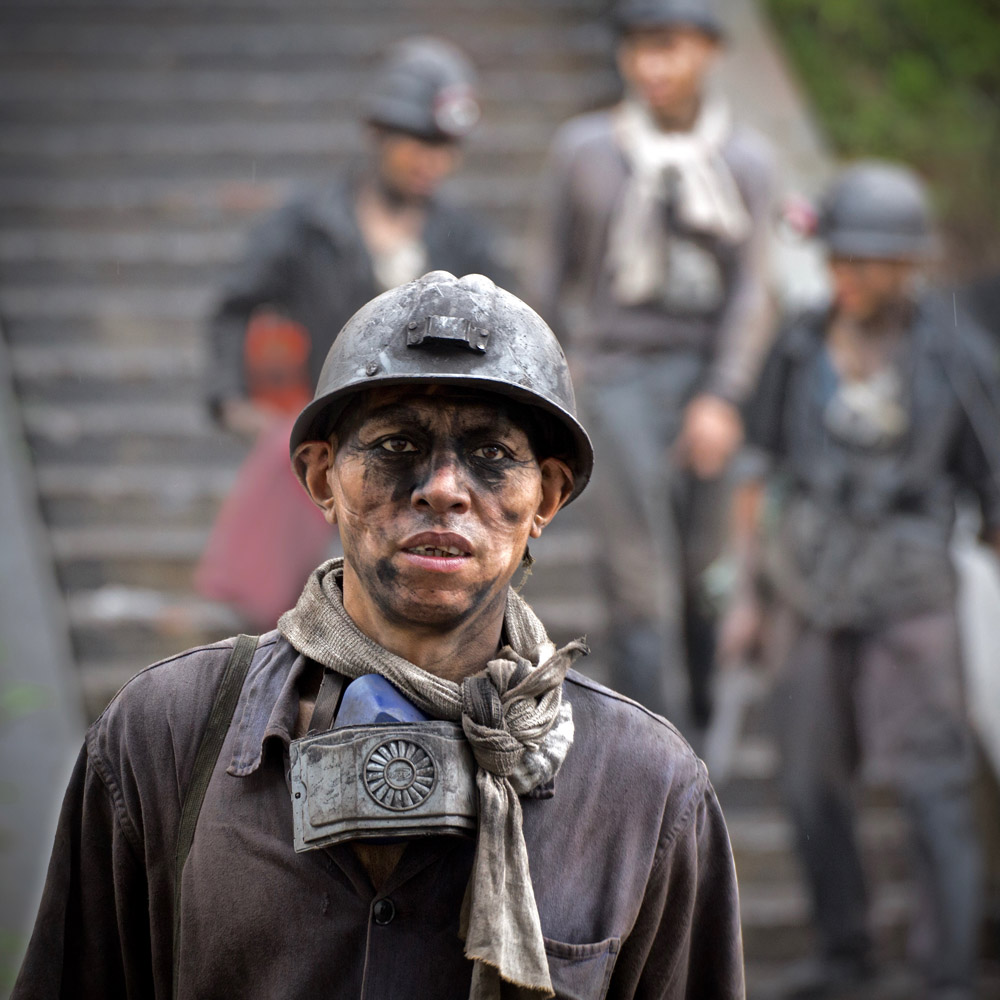A coal miner in China's Sichuan province. Miners recently went on strike after learning that their company hadn't paid their medical and retirement insurance [Steve Chao/Al Jazeera]