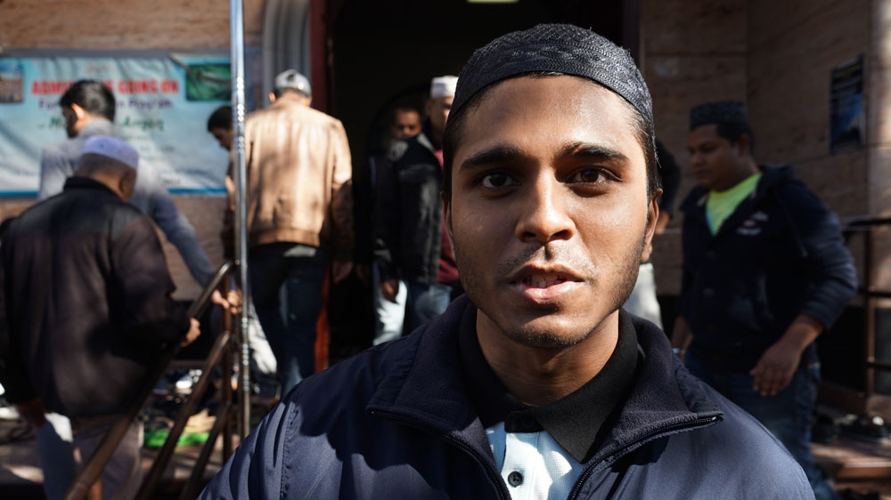 Amin Sattar, a Bangladeshi American, is yet to decide who to vote [James Reinl/Al Jazeera]