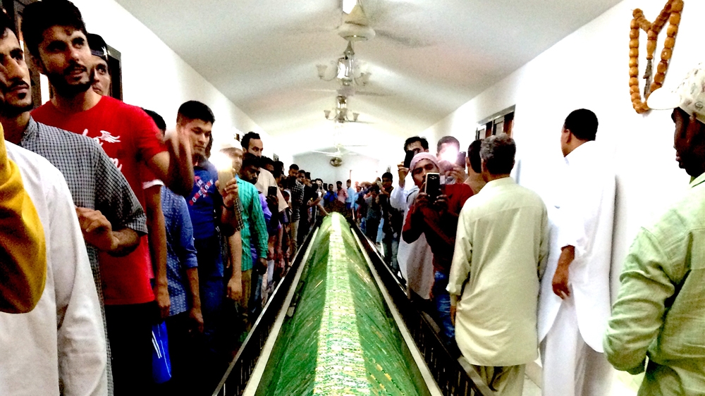 Prophet Umran's 40ft-long grave is located in Salalah city, drawing thousands of pilgrims [Baba Umar/Al Jazeera]