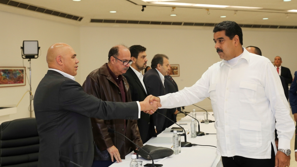 Venezuela''s President Nicolas Maduro shakes hands with Jesus Torrealba, secretary of the MUD, during a political meeting between government and opposition, in Caracas
