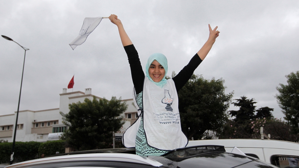 People celebrate after official parliamentary election results were announced in Rabat, Morocco [REUTERS]
