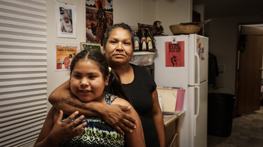 Olowan says she struggled with alcoholism for years before eventually giving it up 11 years after her mother's death [Patrick Strickland/Al Jazeera] 