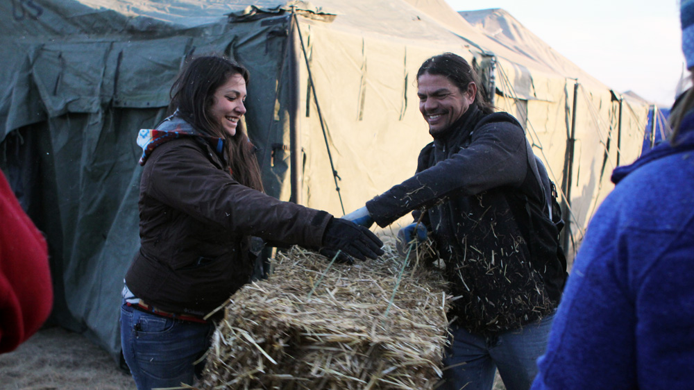 Rene Rodriguez, right, of Puerto Rican Taino heritage, drove to North Dakota from Baltimore, Maryland, to participate in the protest movement [Lauretta Prevost/Al Jazeera]