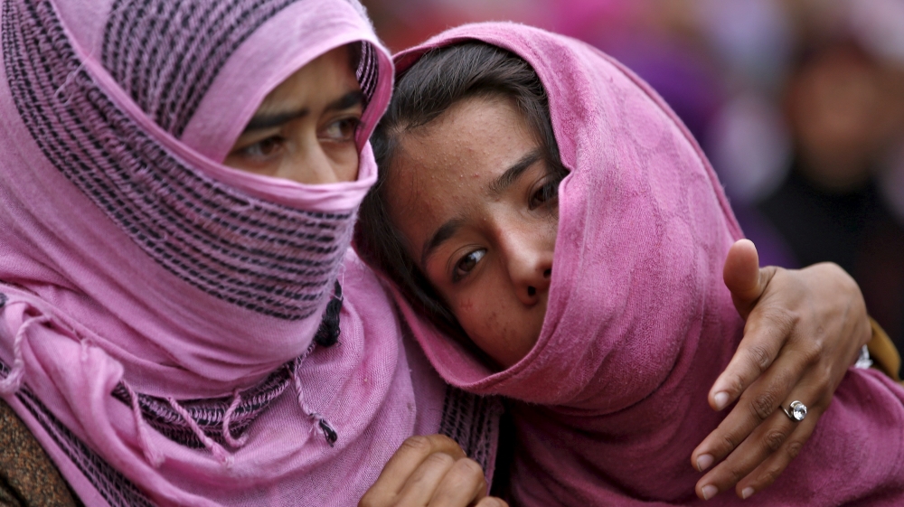 Kashmiri Muslim girls attend the funeral of Bilal Ahamd, a suspected militant, in Karimabad village in south Kashmir