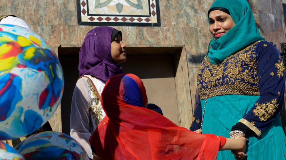People celebrate the Eid holiday that marks the end of the Muslim holy month of Ramadan in the Brooklyn borough of New York City