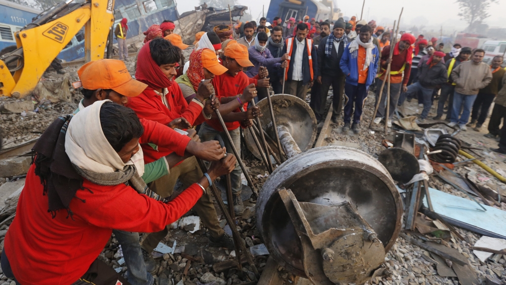 
The passenger train was midway through a 27-hour journey between Indore and Patna when it jumped off the tracks [EPA]
