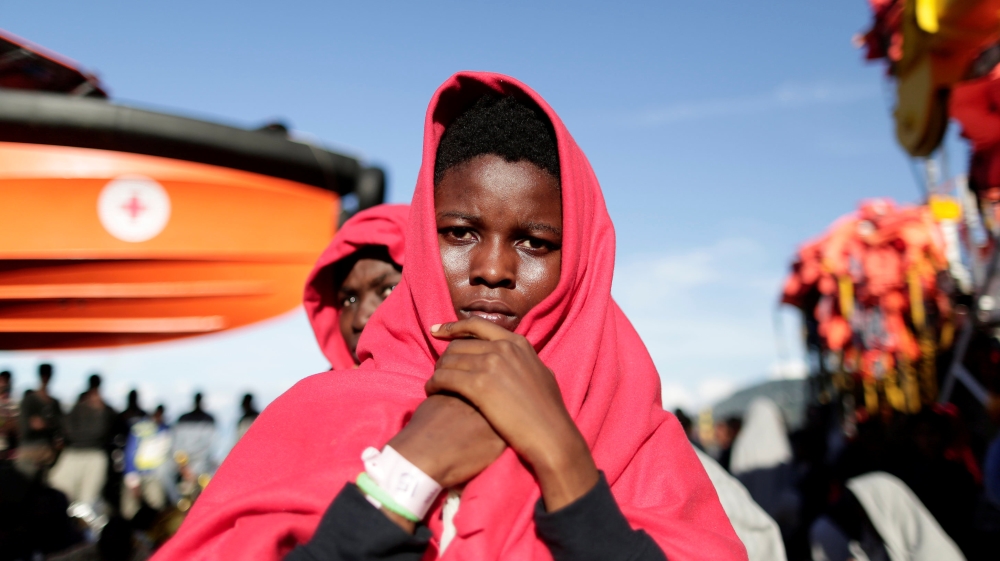 Migrants disembark from the rescue vessel Responder in the Italian harbour of Vibo Marina, Italy