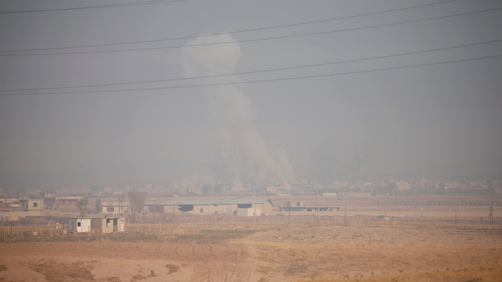 Smoke rises from clashes in the town of Bashiqa
