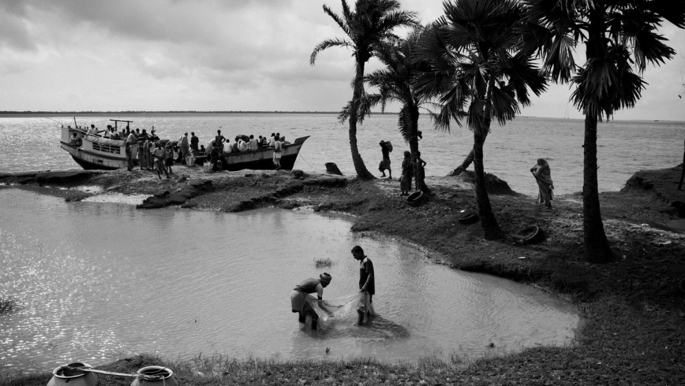  Ghoramara island is known as the 'sinking island'. Located 150km south of Kolkata in the Bay of Bengal's Sunderban delta, the island, once spanning more than 20 sq km, has been reduced to an area of just 5sq km. Global warming has caused the river to grow. Flowing down from the mighty Himalayas, the river brings more and more snowmelt along as it empties into the Bay of Bengal. High tides and floods play havoc on the fragile embankments, displacing hundreds of islanders every year. [Swastik Pal/Al Jazeera] 