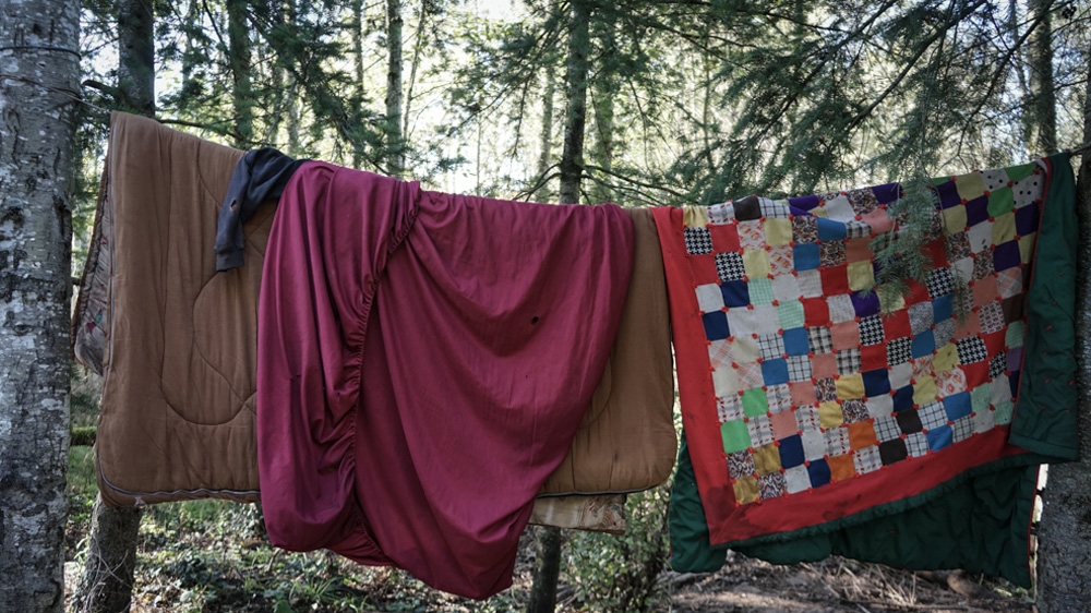 In cities across the US, laws that ban sleeping outside, camping in public places, begging and sleeping on pavements restrict the options available to the homeless [Patrick Strickland/Al Jazeera] 