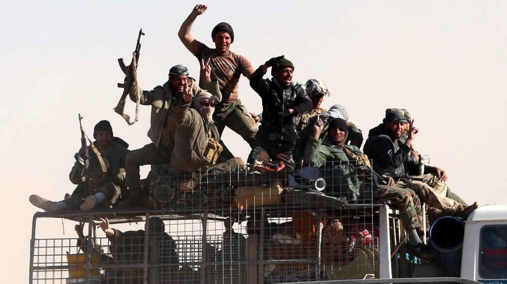 Members of Iraqi Shiite Badr Army militia on their way to take part in a military operation near Tal Afar military airport