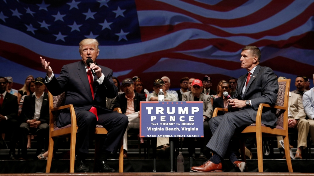 Republican presidential nominee Donald Trump speaks along side retired U.S. Army Lieutenant General Michael Flynn during a campaign town hall meeting in Virginia Beach, Virginia