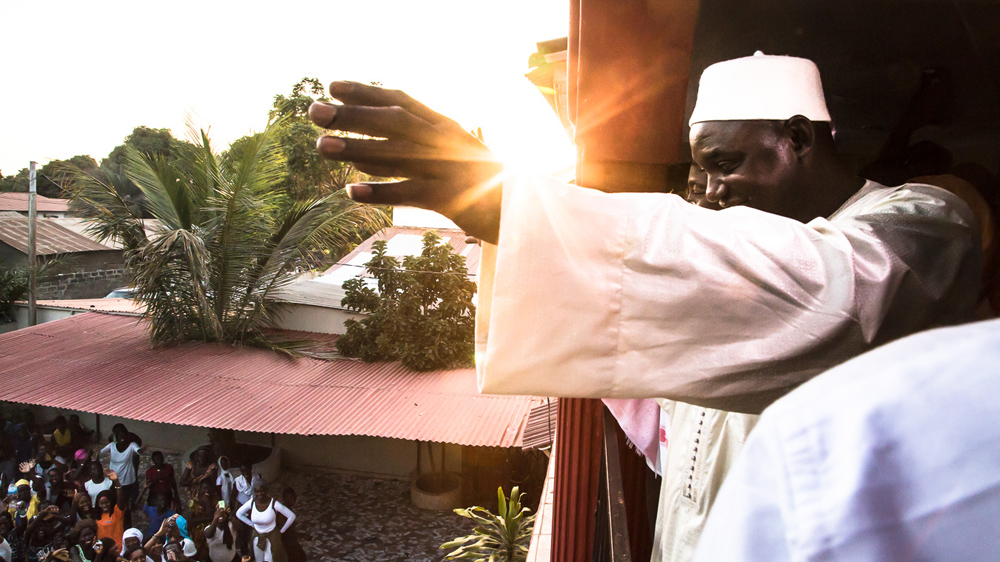 President-elect Adama Barrow addresses crowds outside his residence [Misha Somerville/Al Jazeera]